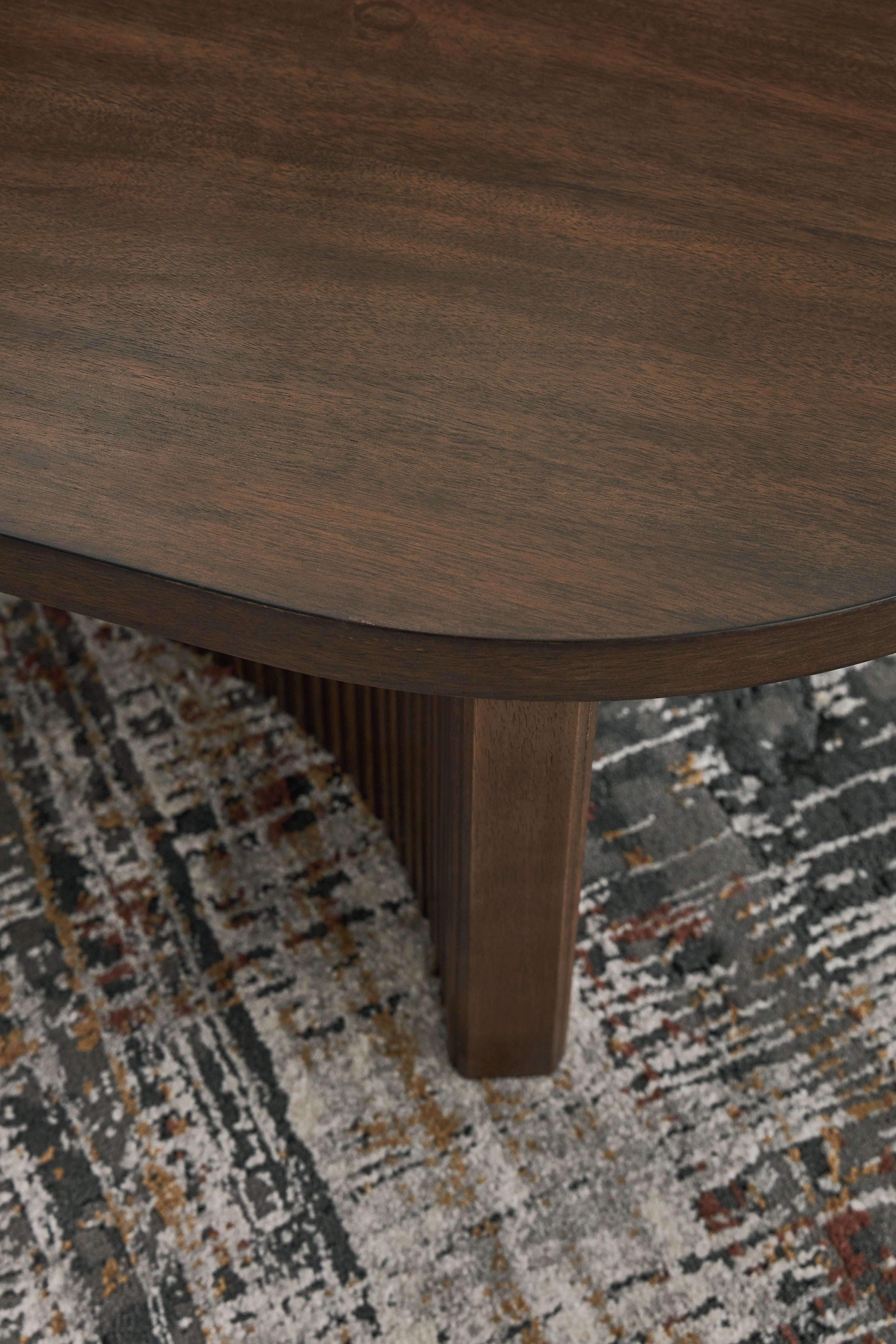 Korestone - Oval Cocktail Table - Dark Brown
