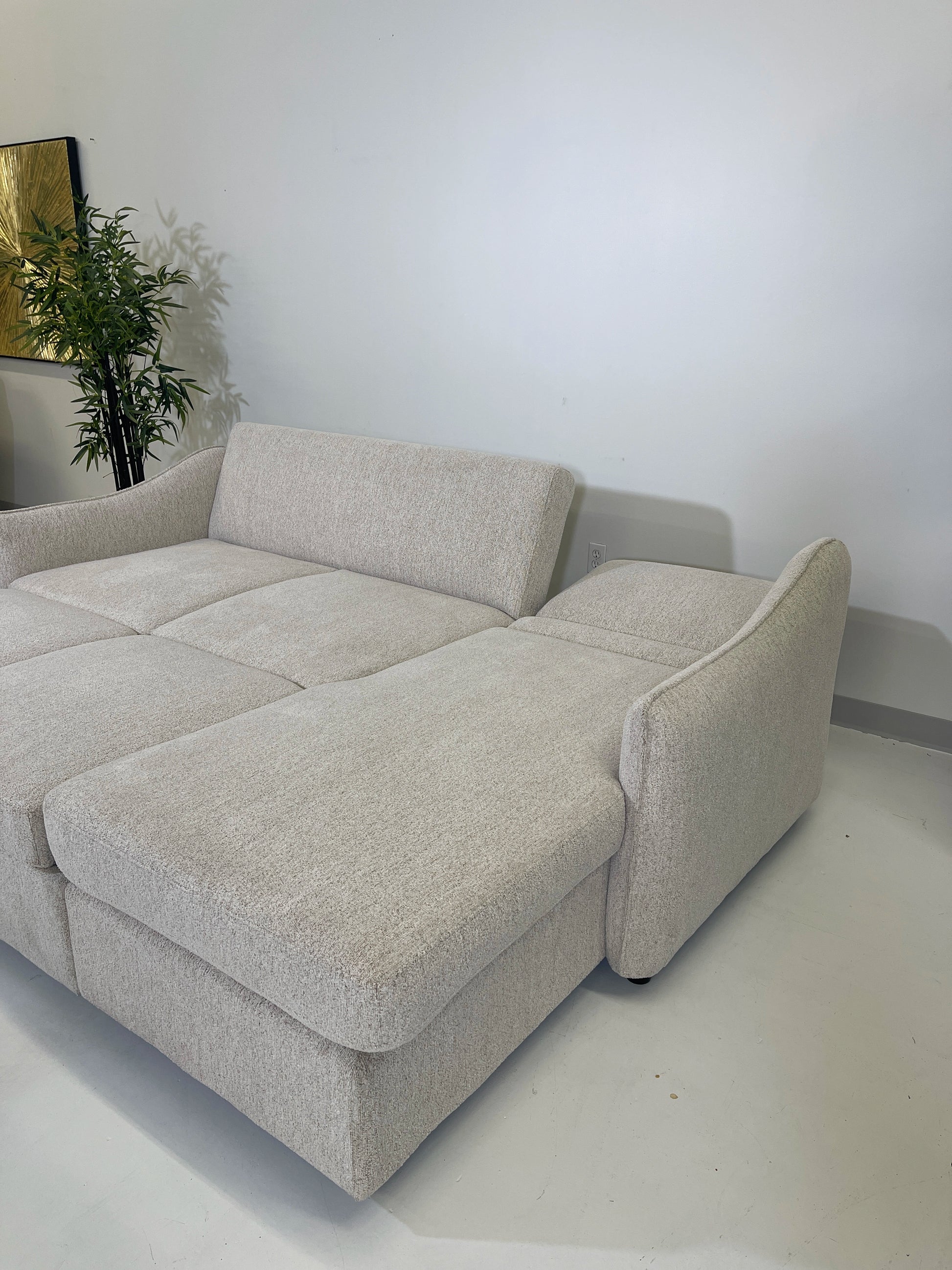 media sleeper with adjustable back down detail side shot, knife edge arm, lounge area